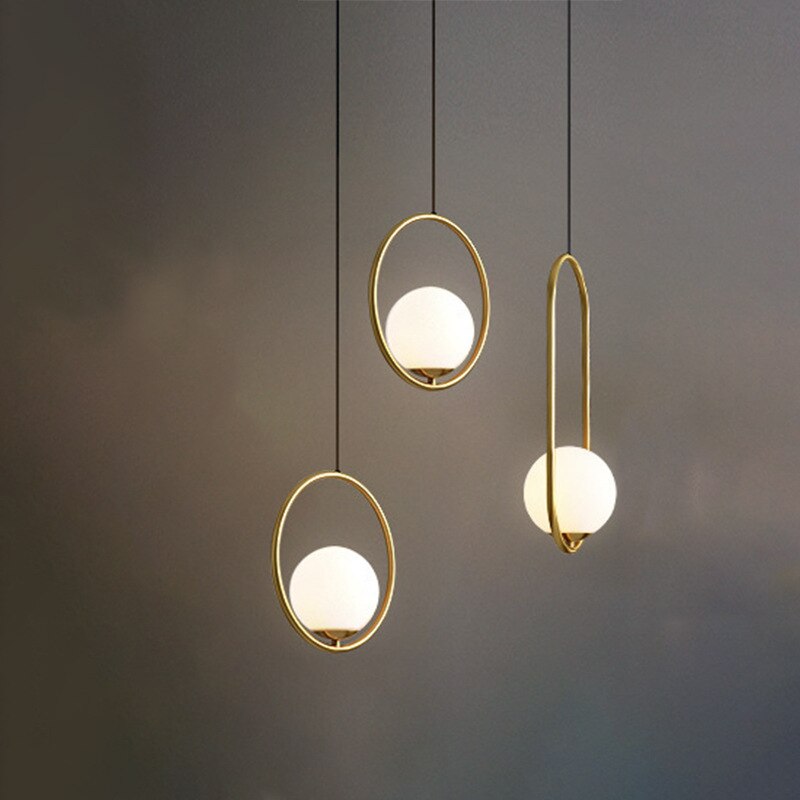 Suspension luminaire design doré DINA – Mabaha